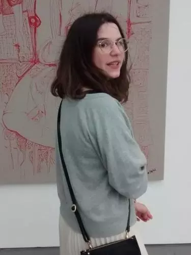 Michal Zechariah looking over her shoulder toward the camera.