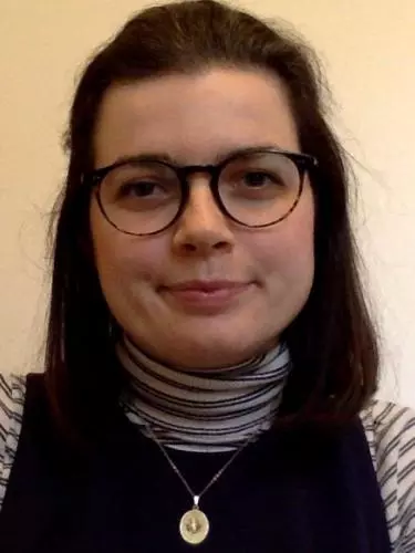 Photo of Annalisa Nicholson smiling to camera in front of a white background.