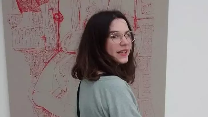 Michal Zechariah looking over her shoulder toward the camera.