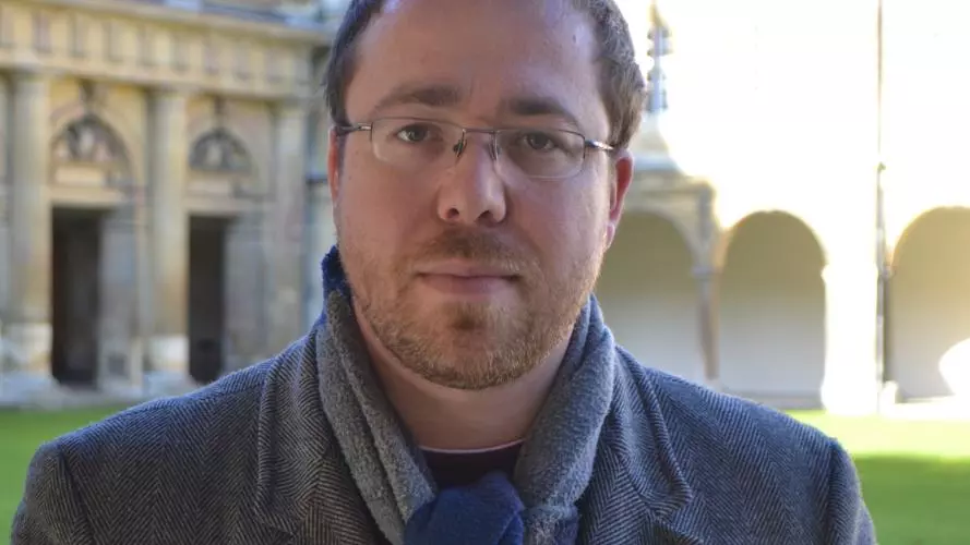 Photo of Joe Moshenska outside looking to camera. 