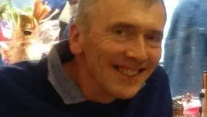 Photo of Gervase Rosser smiling to camera.