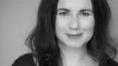 Black and white photo of Andrea Stevens against plain background.
